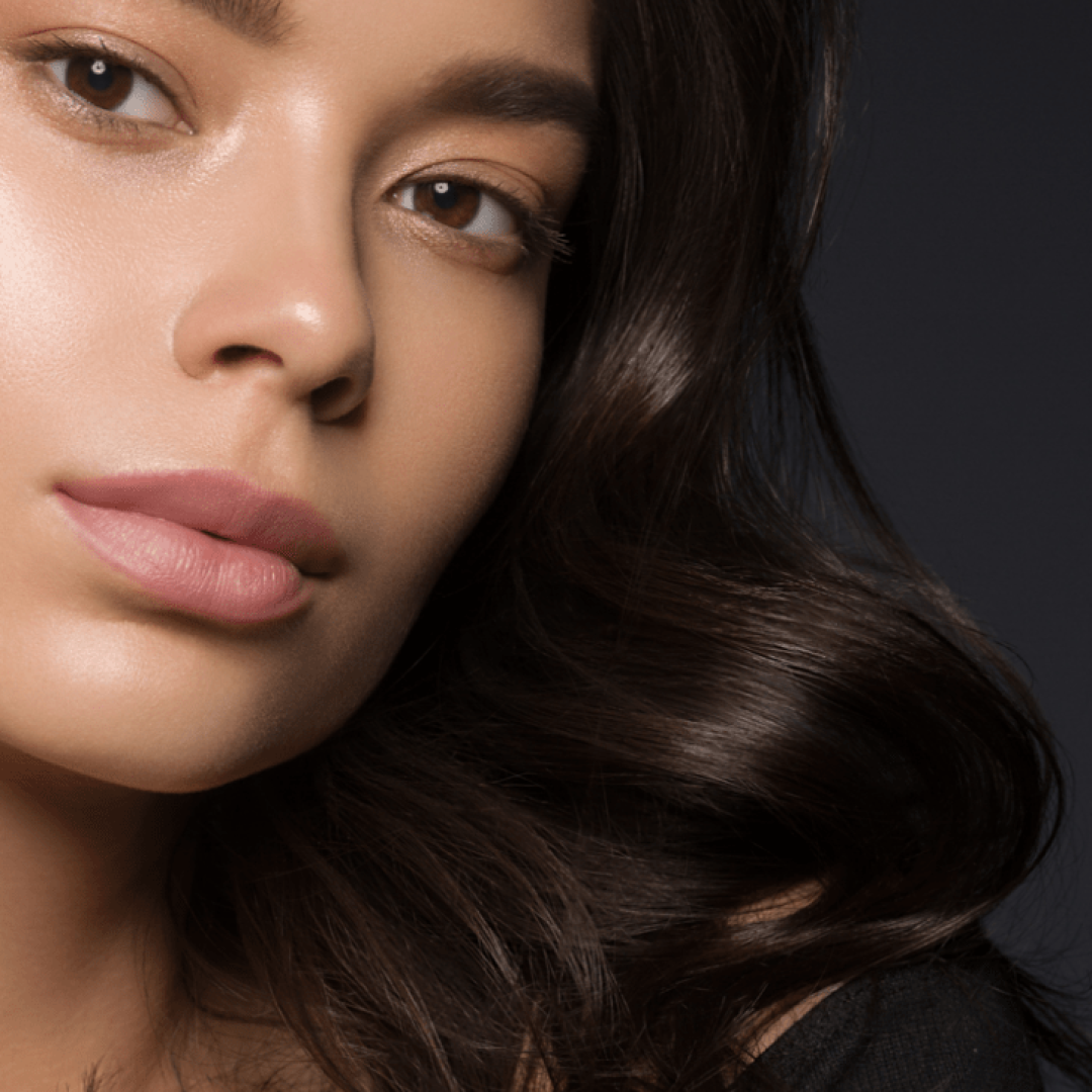 asian-beauty-female-black-background-curly-black-hair-natural-make-up-studio-shot (1)